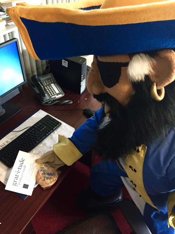 Arnie leaves a thank-you cookie for an on-campus donor