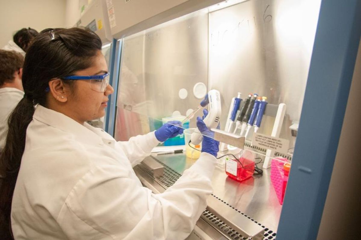 Female student in sterile bioengineering laboratory