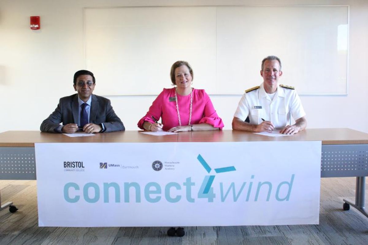 Deans signing agreement