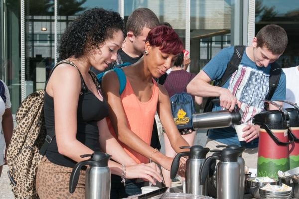Students pouring coffee