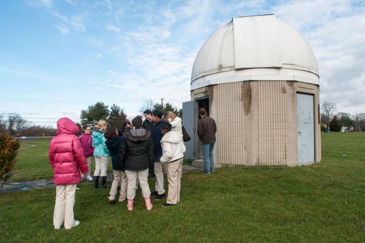 Crowd gathers at UMassD Observatory