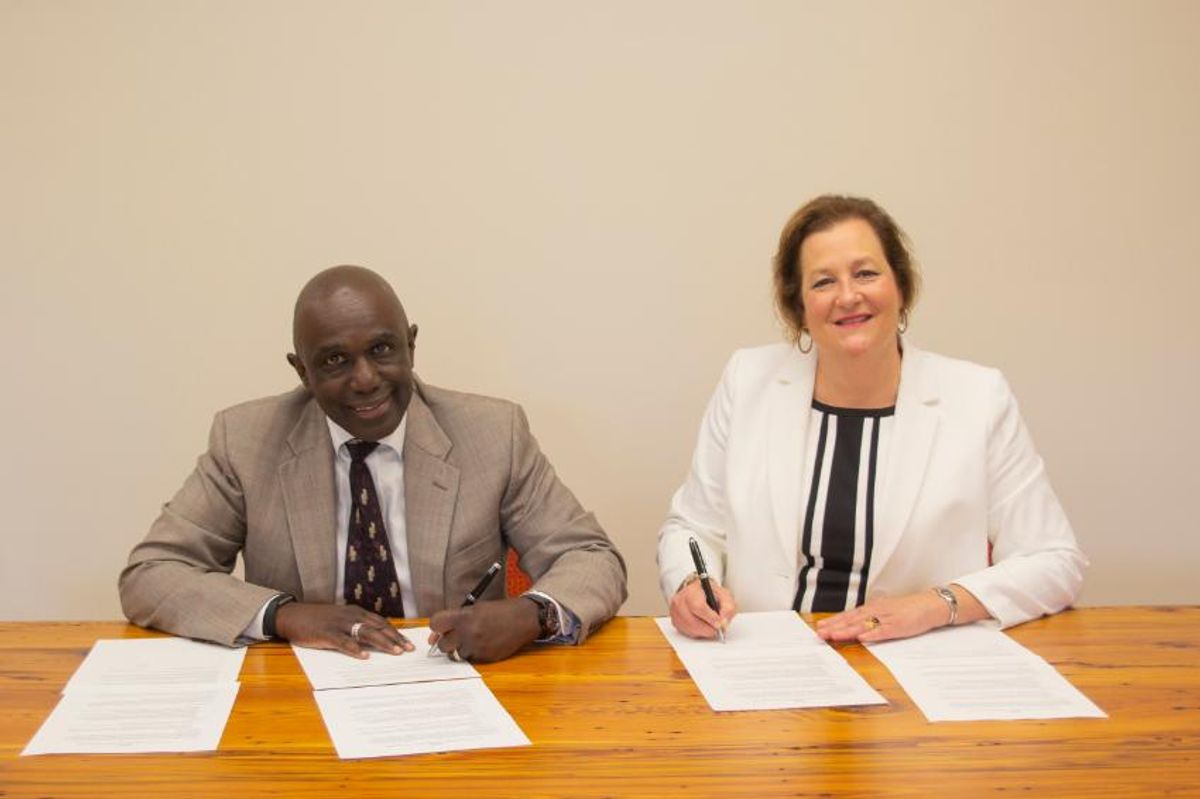 Chancellor Johnson and President Douglas sign agreement