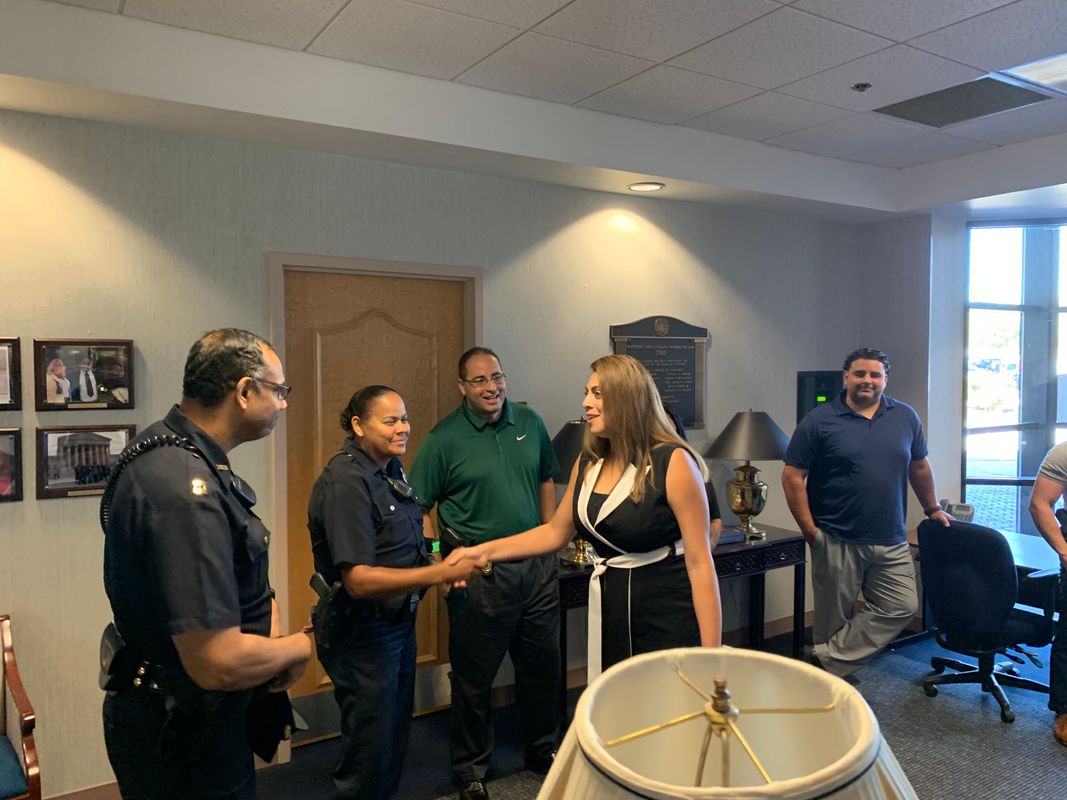 New Bedford Police Officers greeting Law student