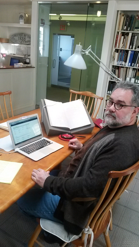 Professor Walker with historical logbooks