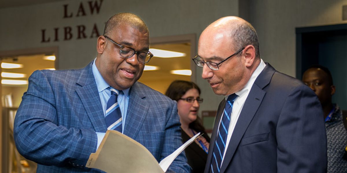 Judge Georges showing Dean Mitnick a file