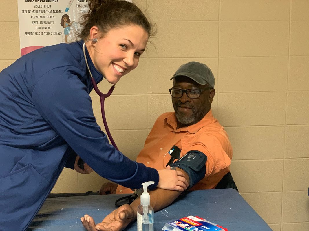 Nursing student training community health worker