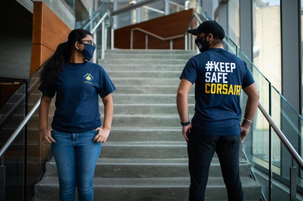 Student clean team members with UMassD shirts