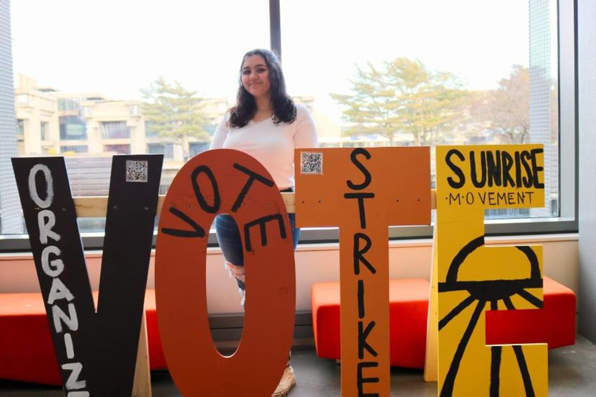 Student made V-O-T-E signs