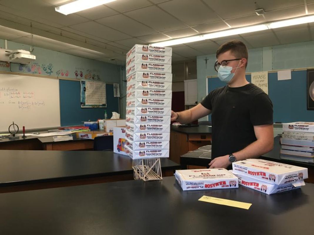 Student with custom made model bridge