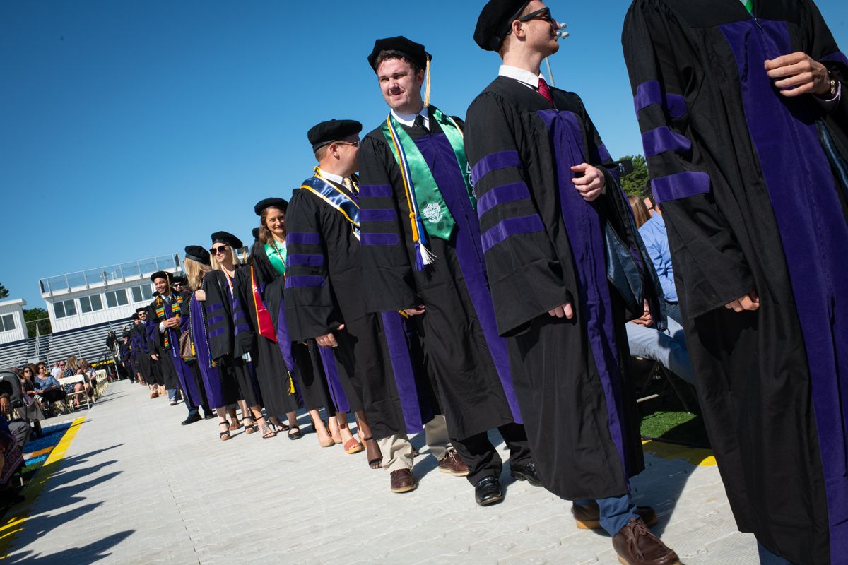 Students at graduation in regalia
