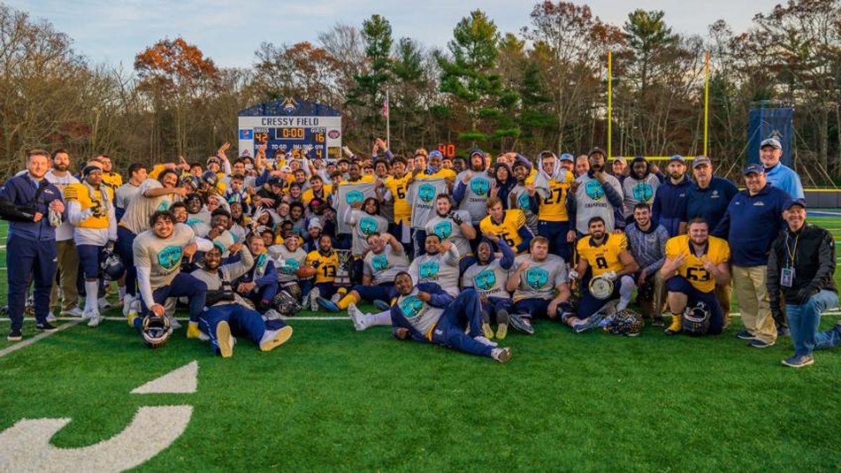 Football team holding trophy