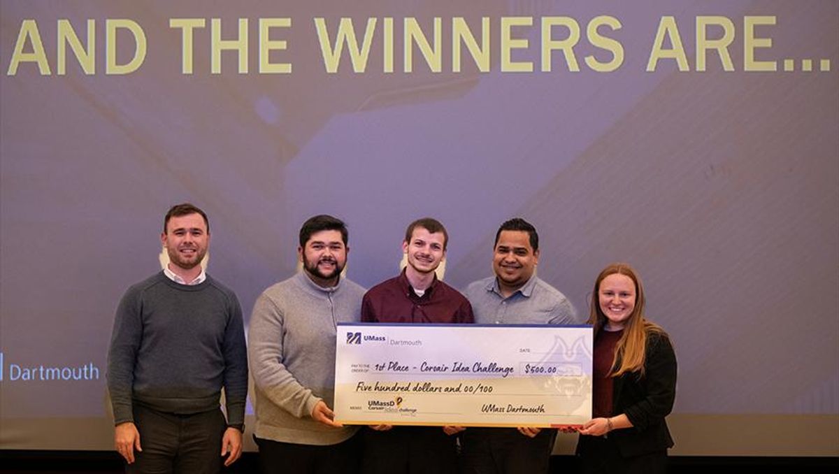 Corsair Idea Challenge founder Jacob Miller ‘16 presents Ethan Osley, Shawn Marcoux, Damian Guilbe Boscana, and Christina Hart with their first-place, $500 check.