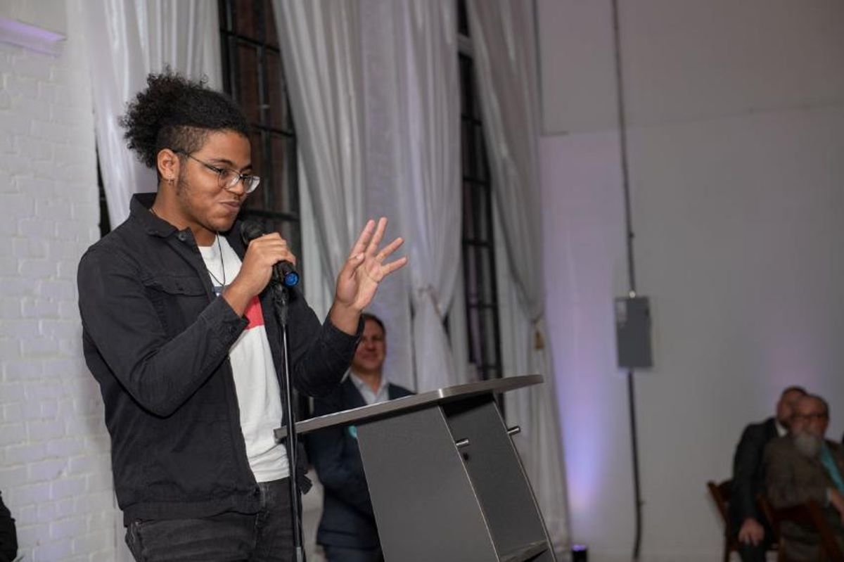 Student Gabriel Johnson addresses crowd