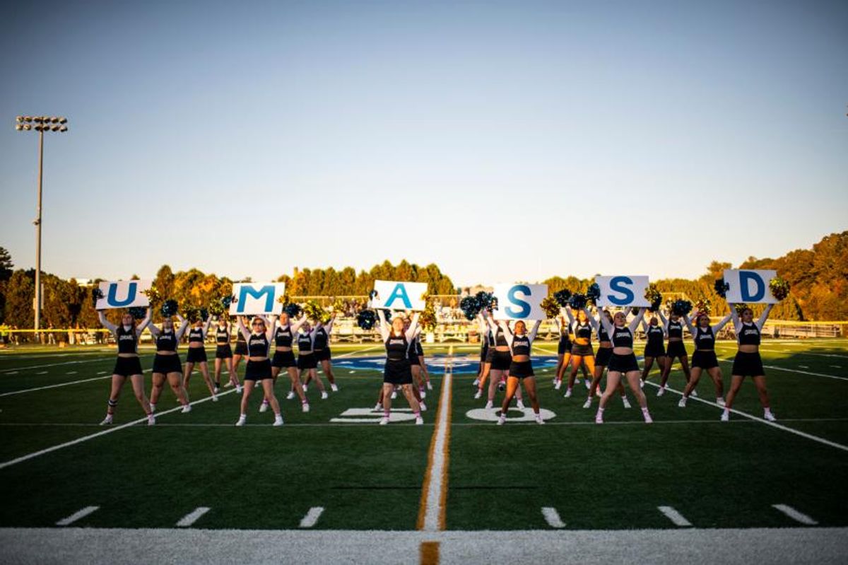 UMassD Corsair Cheerleaders on the football field