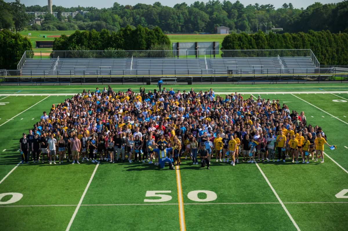 Class of 2027 group photo on football field