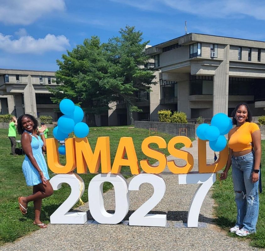 Students in front of UMassD 2027 letters