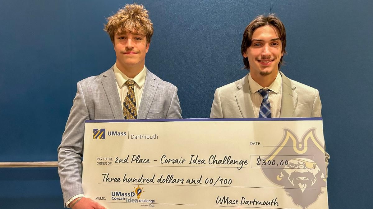 Seniors Christian Fall (left) and Logan Bento (right) pose with their ceremonial second-place check