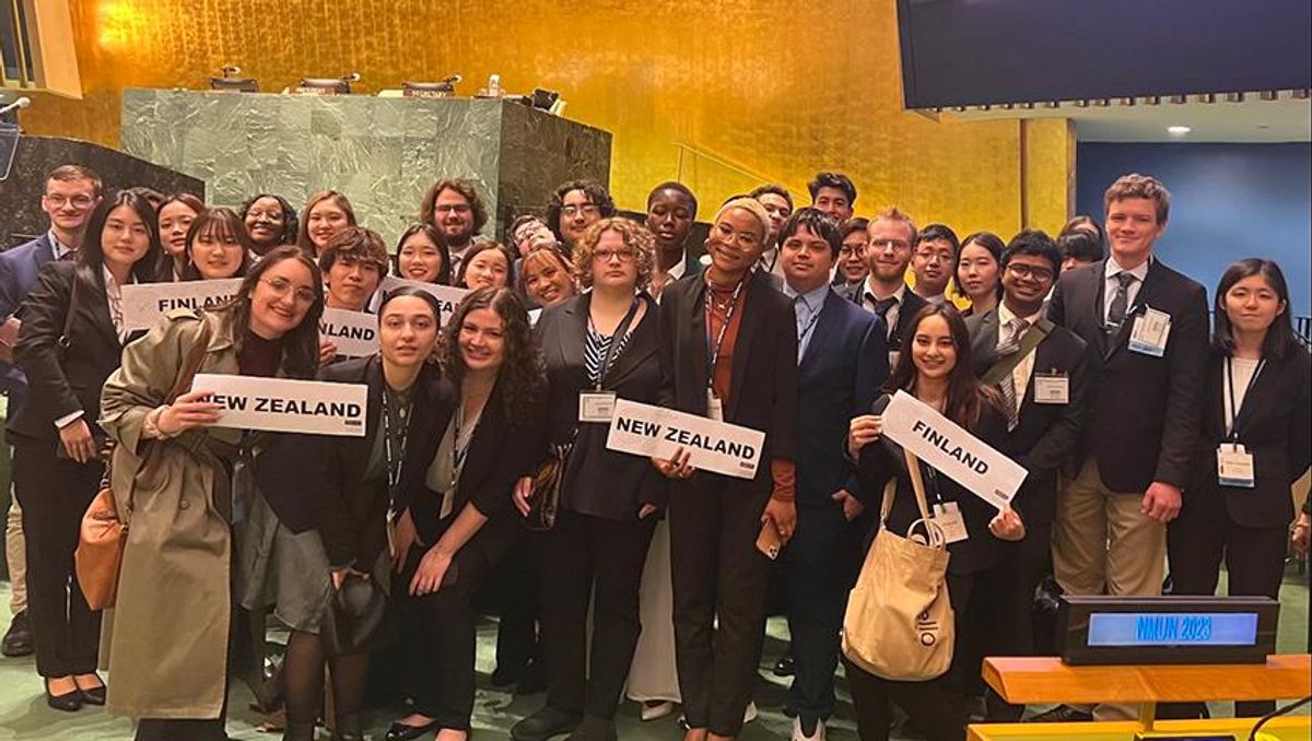 Twenty members of the UMassD Model UN team and 14 students from Japanese universities pose for a picture after winning outstanding delegation in New York City.