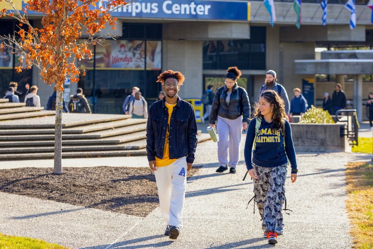 Students walking campus in fall