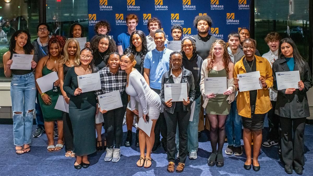 The College Now/START program first-year class poses in celebration of becoming degree candidates at .