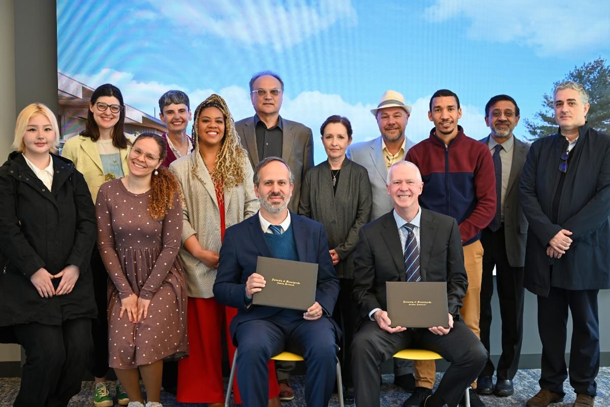 Students, faculty, and administrators gather to celebrate signing of agreement