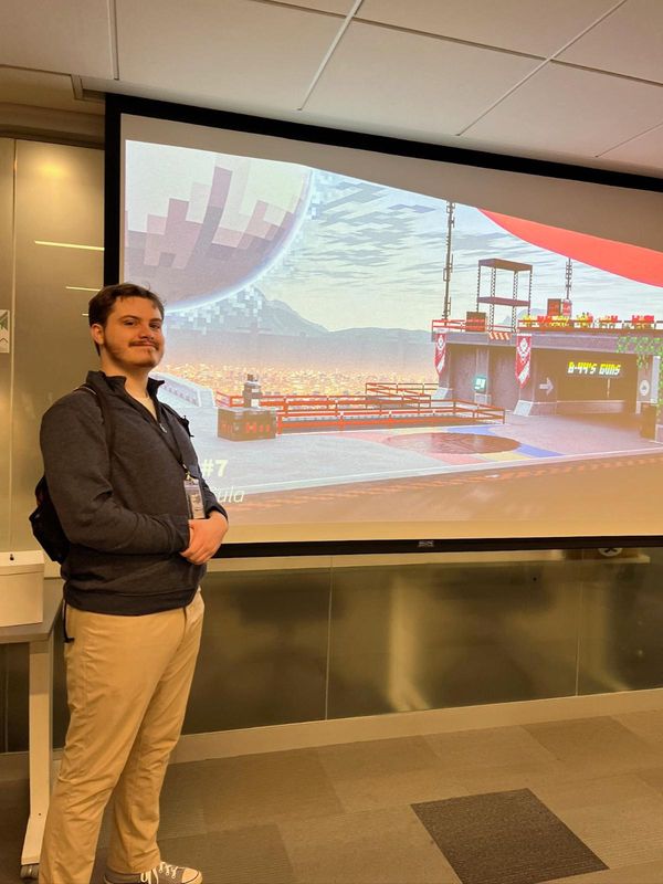 Jared Gula in front of his work at JoyArt Boston