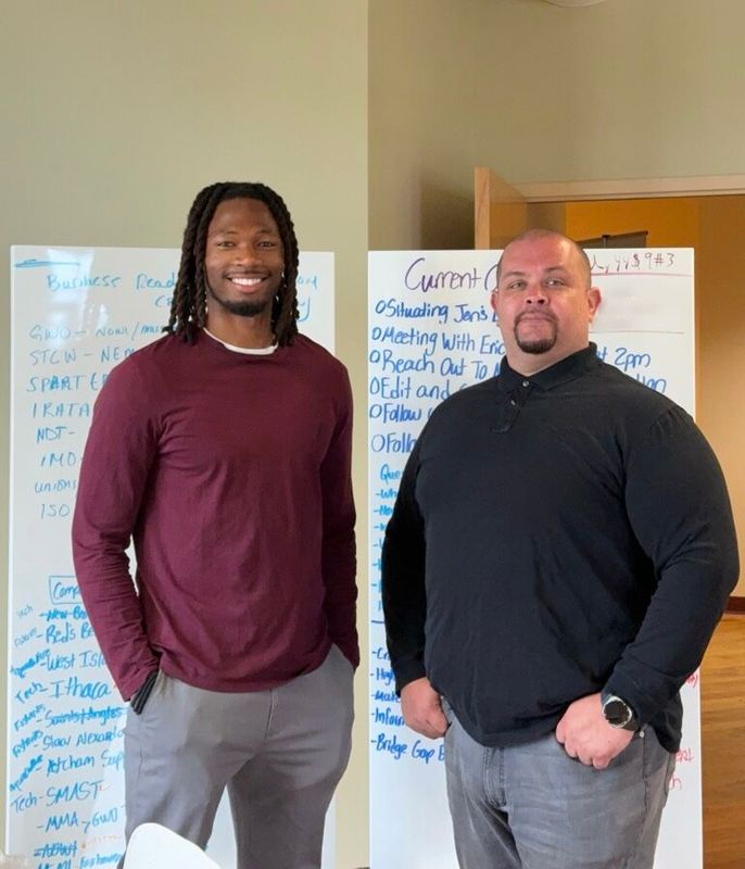 Marketing student Sam Riley '25 and Carlos Avila, business development manager at the New Bedford Ocean Cluster,