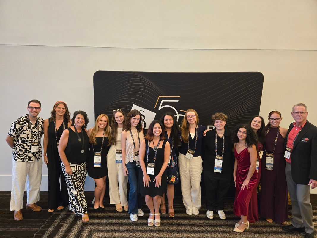 Interior Architecture + Design students and faculty posing with by ASID NE members