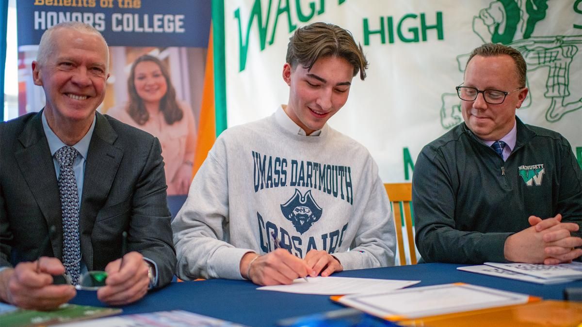 UMassD Chancellor Fuller and Founders' recipient Jack Greene with his high school principal at the Founders' Signing Day