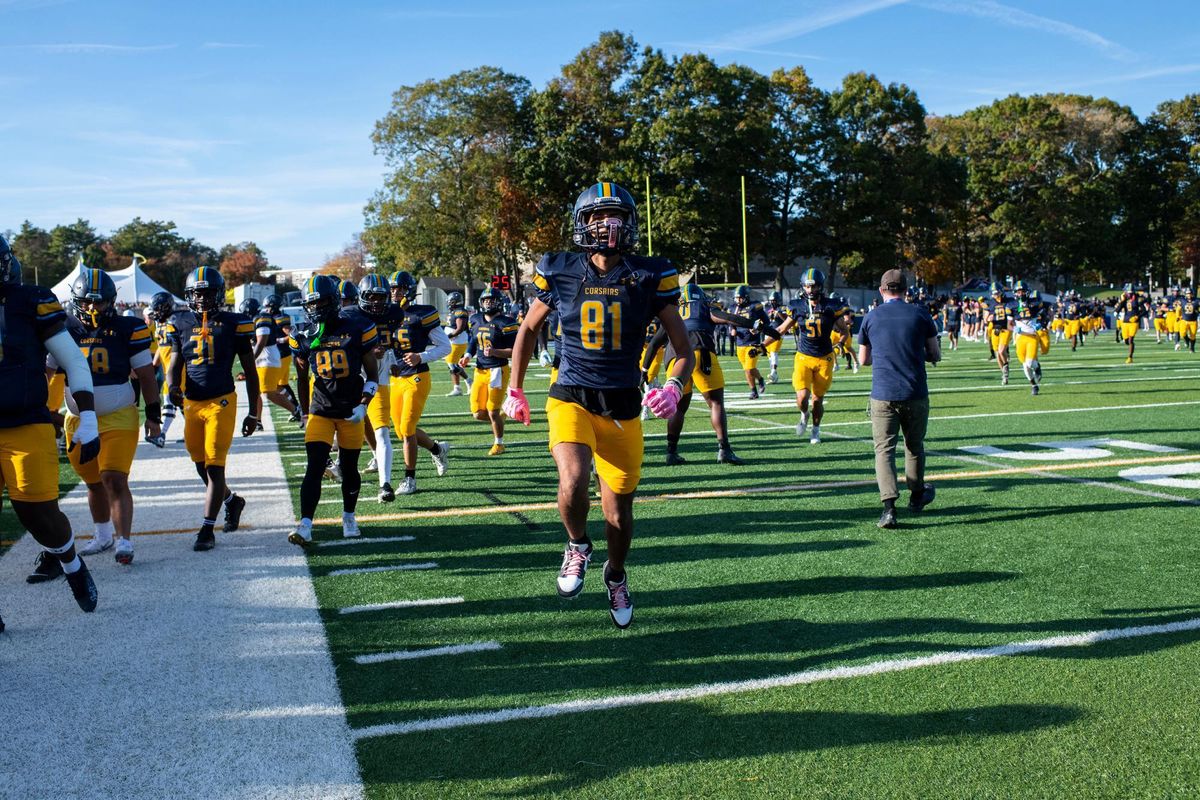 Football players running off the field