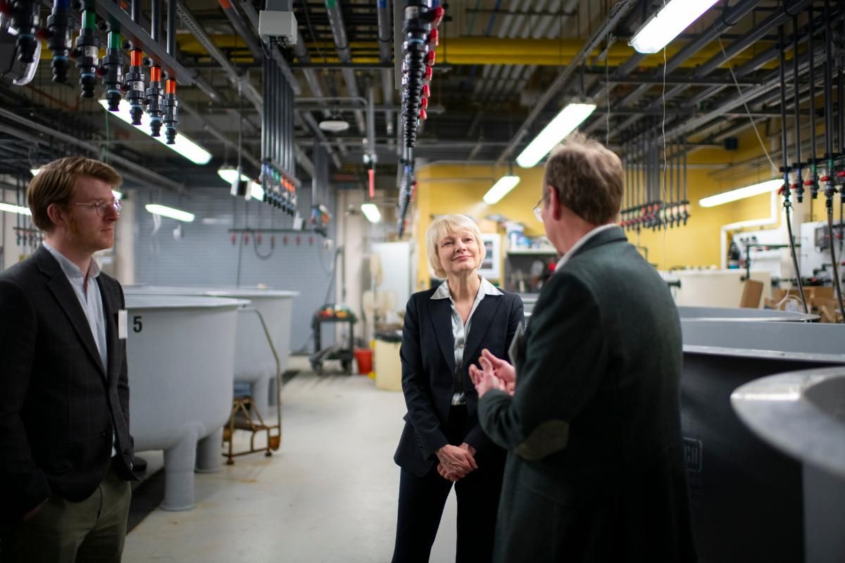 MassCEC CEO Emily Reichert and SMAST Dean Kevin Stokesbury in the seawater lab