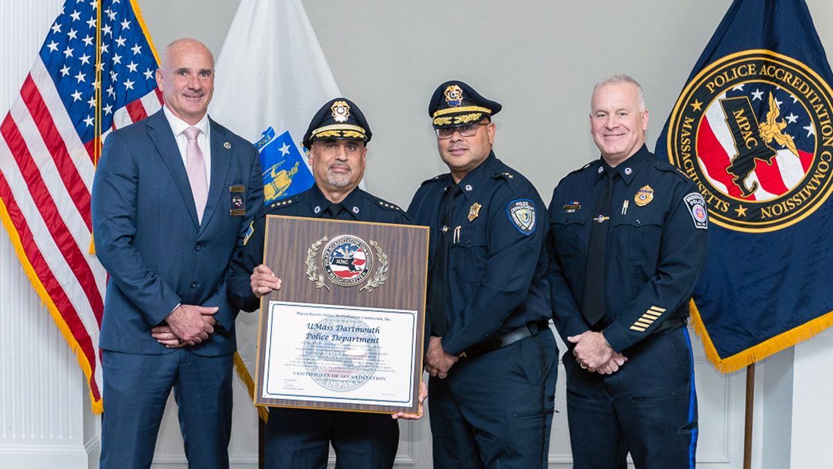 Police officers posing with award