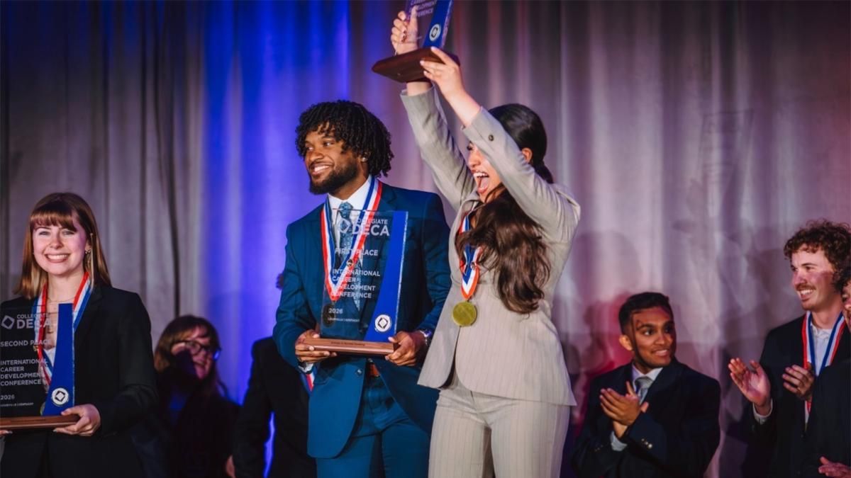 Manuel Frederico Jr. (left) and Jackie Sassin (right) earned a DECA glass award, placing 1st in Business-to-Business Marketing.