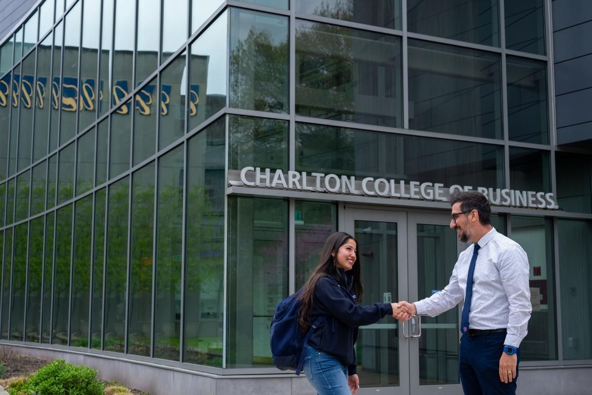 CCB exterior handshake faculty student