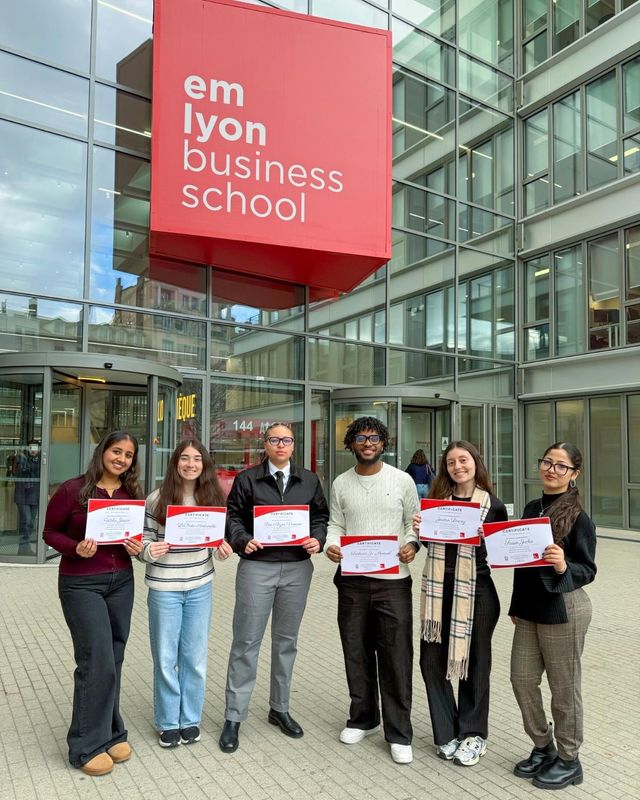 Six Charlton College of Business students pictured outside emlyon business school in Lyon, France.