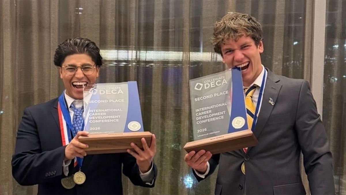 Dominik Aguilar (left) and Matthew Borges (right) earned a DECA glass award, placing 2nd in Sports Marketing.