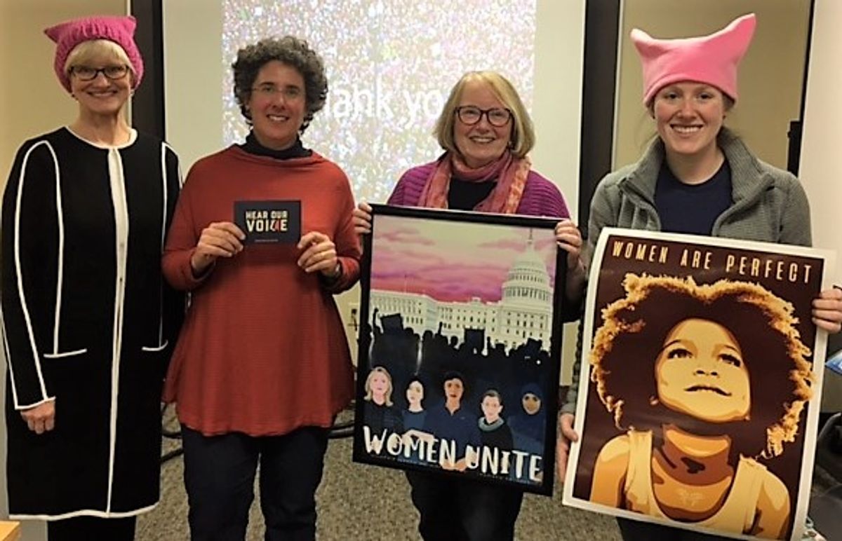 Law student Mary Chaffee, Law Professor Margaret Drew, Law Professor Hillary Farber, and law student Mary McBride speak on a panel about women's marches in Washington, D.C., and Boston