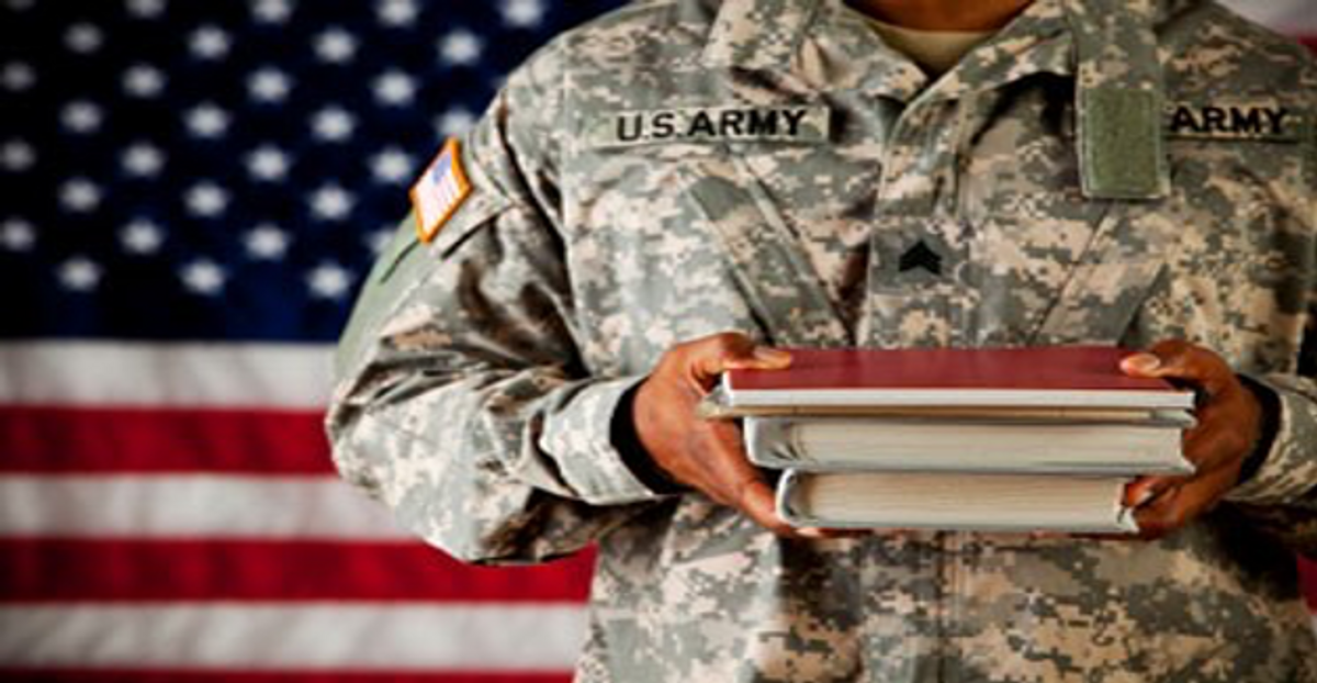 veteran holding books