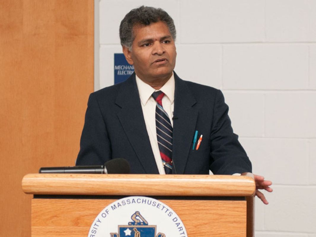 Professor Satya Parayitam at podium