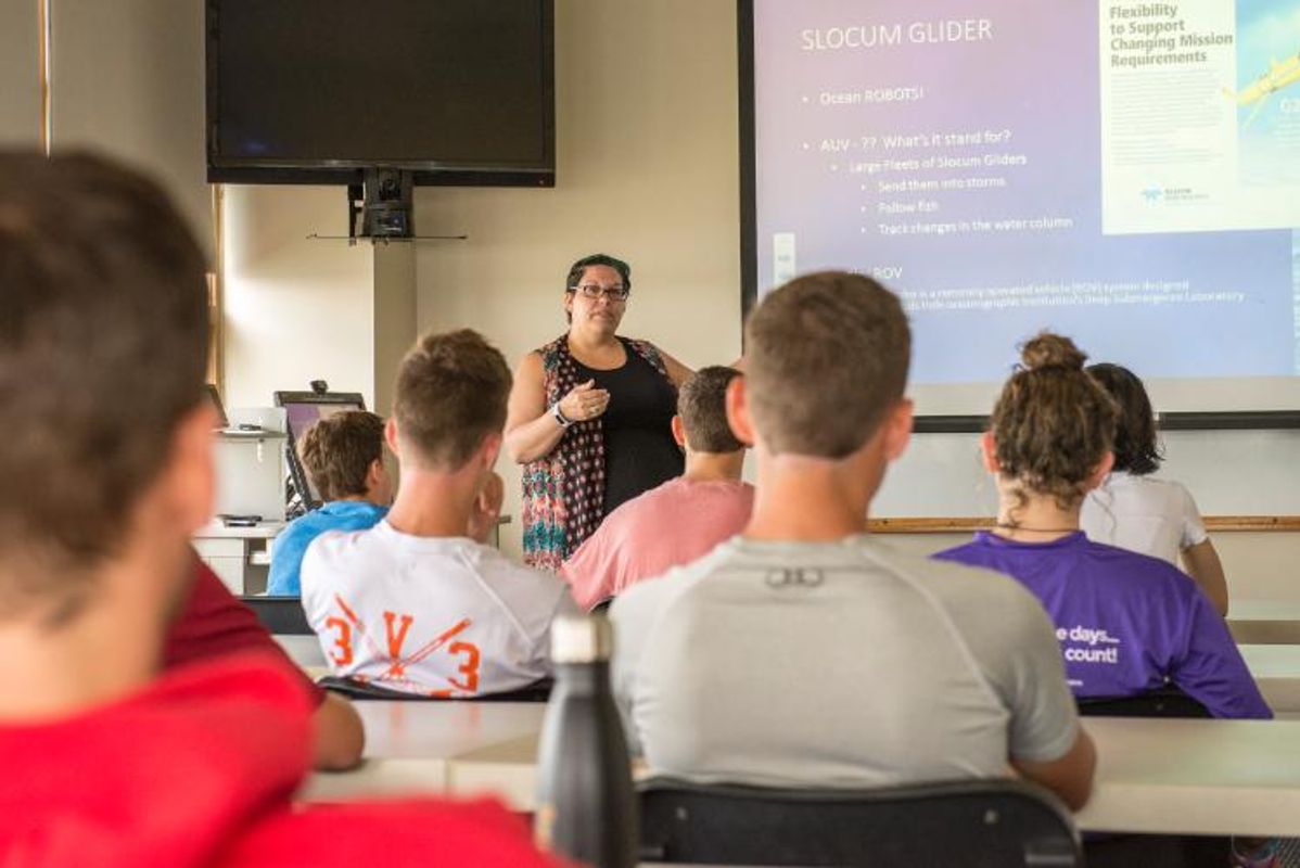 Research Assistant Kate Tremblay gives i incoming Tabor Academy students a lesson on ocean technology. 