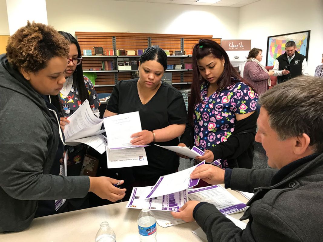 Students at a CNA job fair