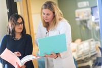 Nursing PhD students conversing.