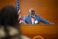 Ucal Palmer '94 speaking at networking event