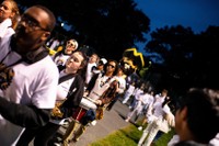 The Pep Band walks into Cressy Field with mascot Arnie the Corsair ahead of whiteout football game.