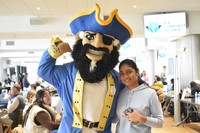 Arnie and a student at a Career Fair