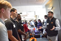 Students visiting tables at a career fair
