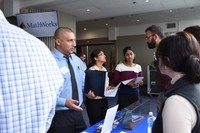 Vendors talking to students at a career fair