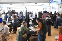 Students visiting tables at a career fair