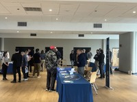 Students speaking to vendors at a hiring event