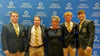 UMassD DECA attending ICDC in Baltimore, April 2022. (Left to Right: Joshua Keith, Benjamin Silvia, Professor Jacqueline Einstein, Samuel Dunn, and Dylan Cantara)